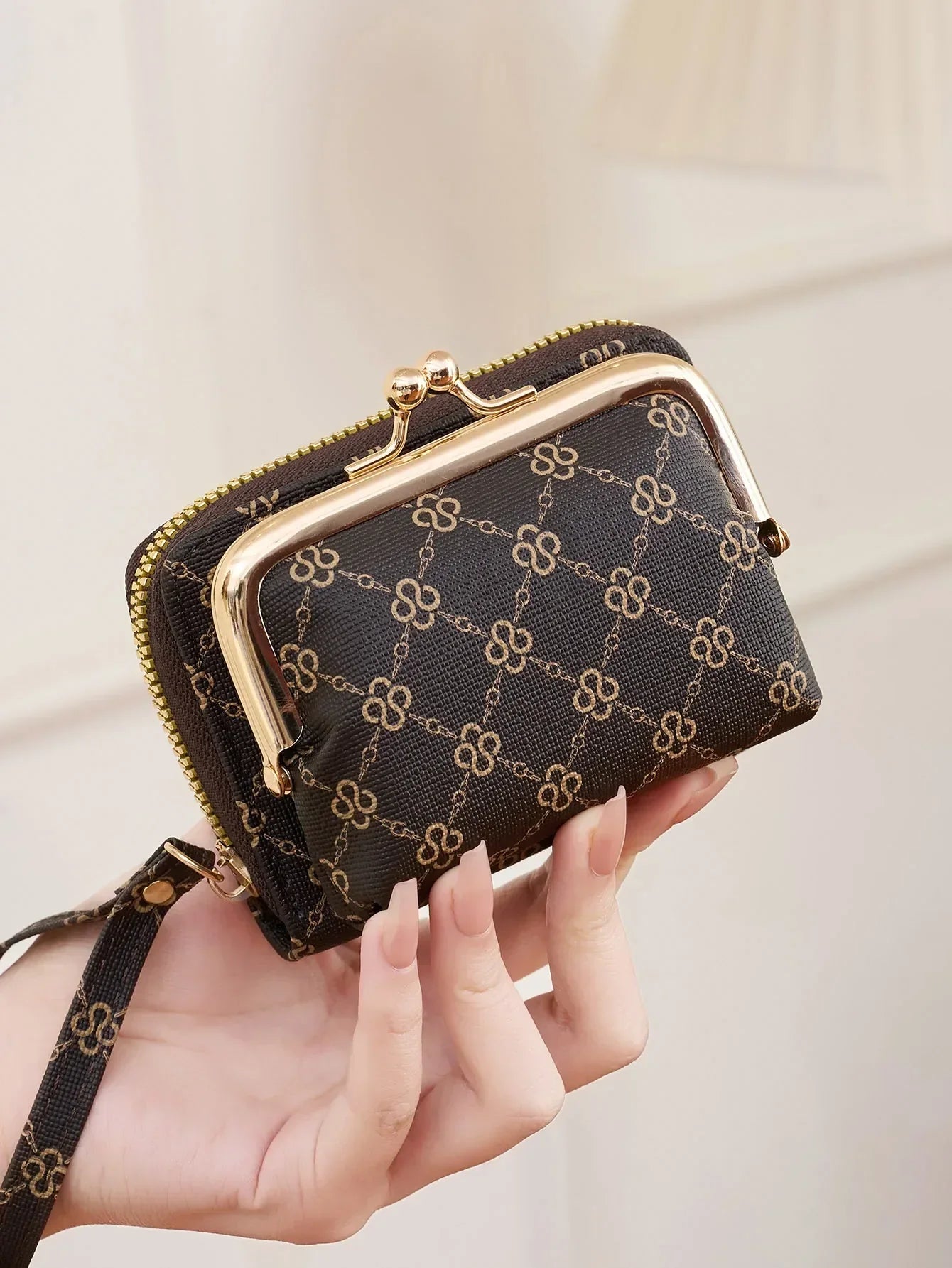 Compact women's wallet with geometric vintage print, zipper closure, coin purse, card holder, and wristband strap