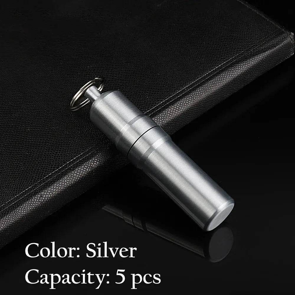 Silver metal cigarette case with keychain, portable and waterproof, capacity for 5 cigarettes.