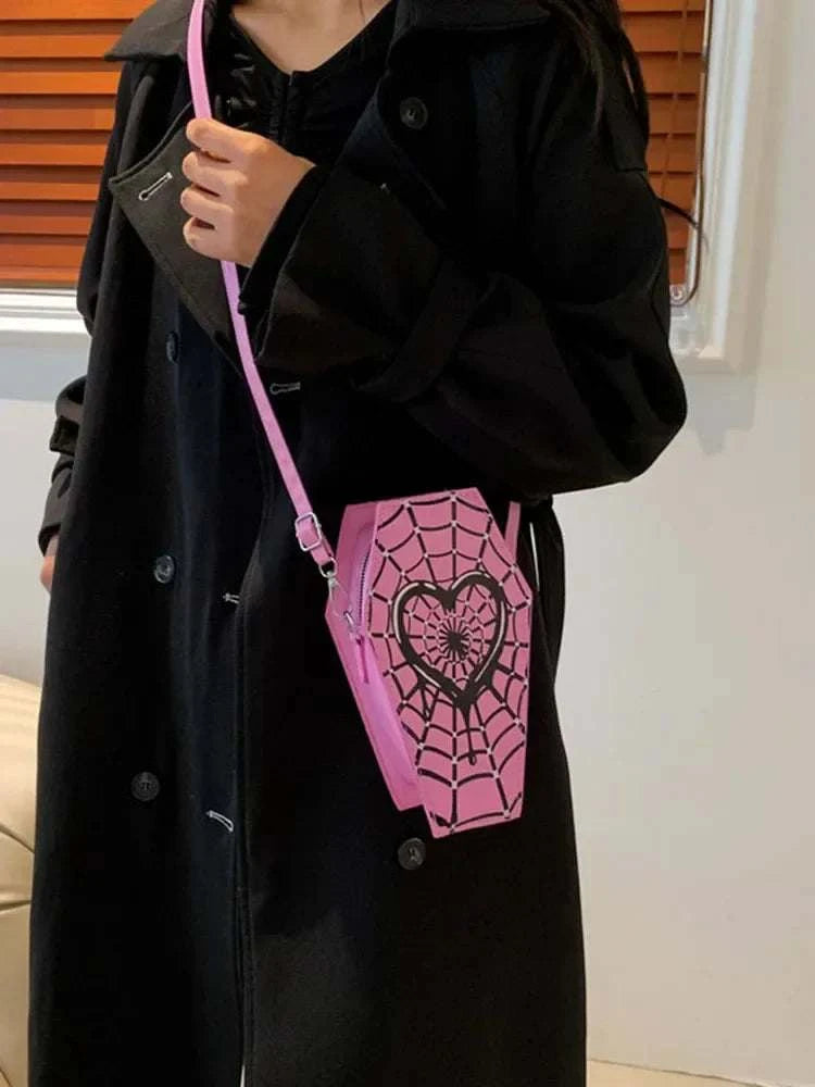 Pink coffin-shaped women fashion shoulder bag with black spider web and heart design, adjustable strap, casual PU leather satchel.