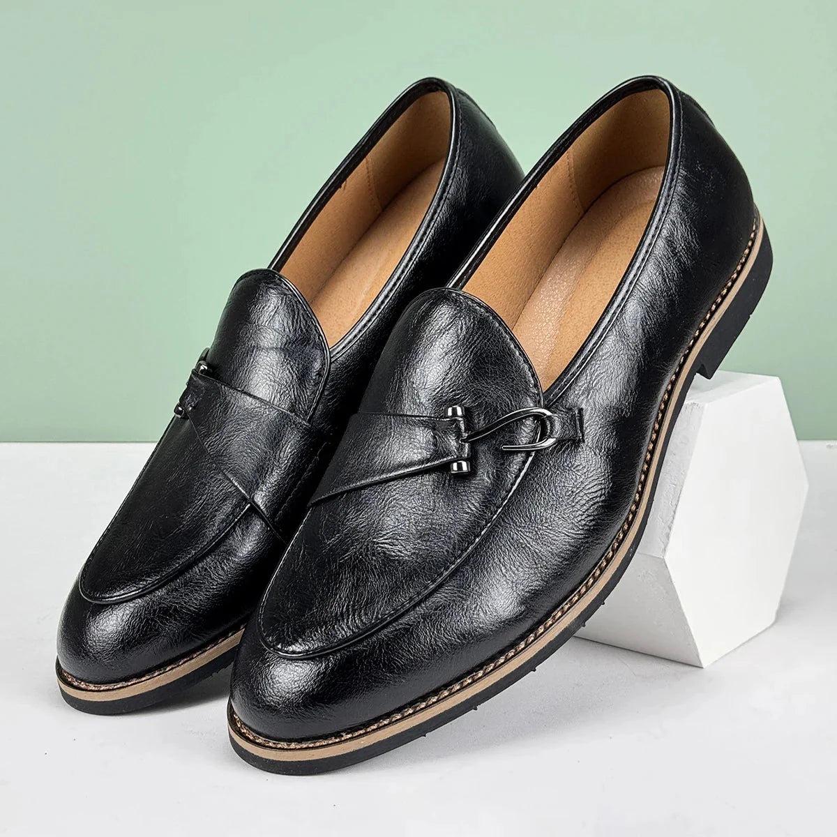 Black men's formal leather loafers with pointed toe, slip-on design, and non-slip rubber sole for business and wedding wear