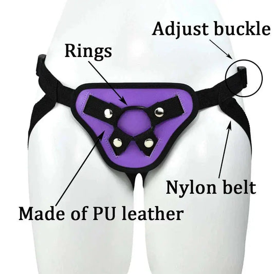 NYOTA leather strap-on harness with adjustable buckle and multiple rings, featuring a purple PU leather design and nylon belt.