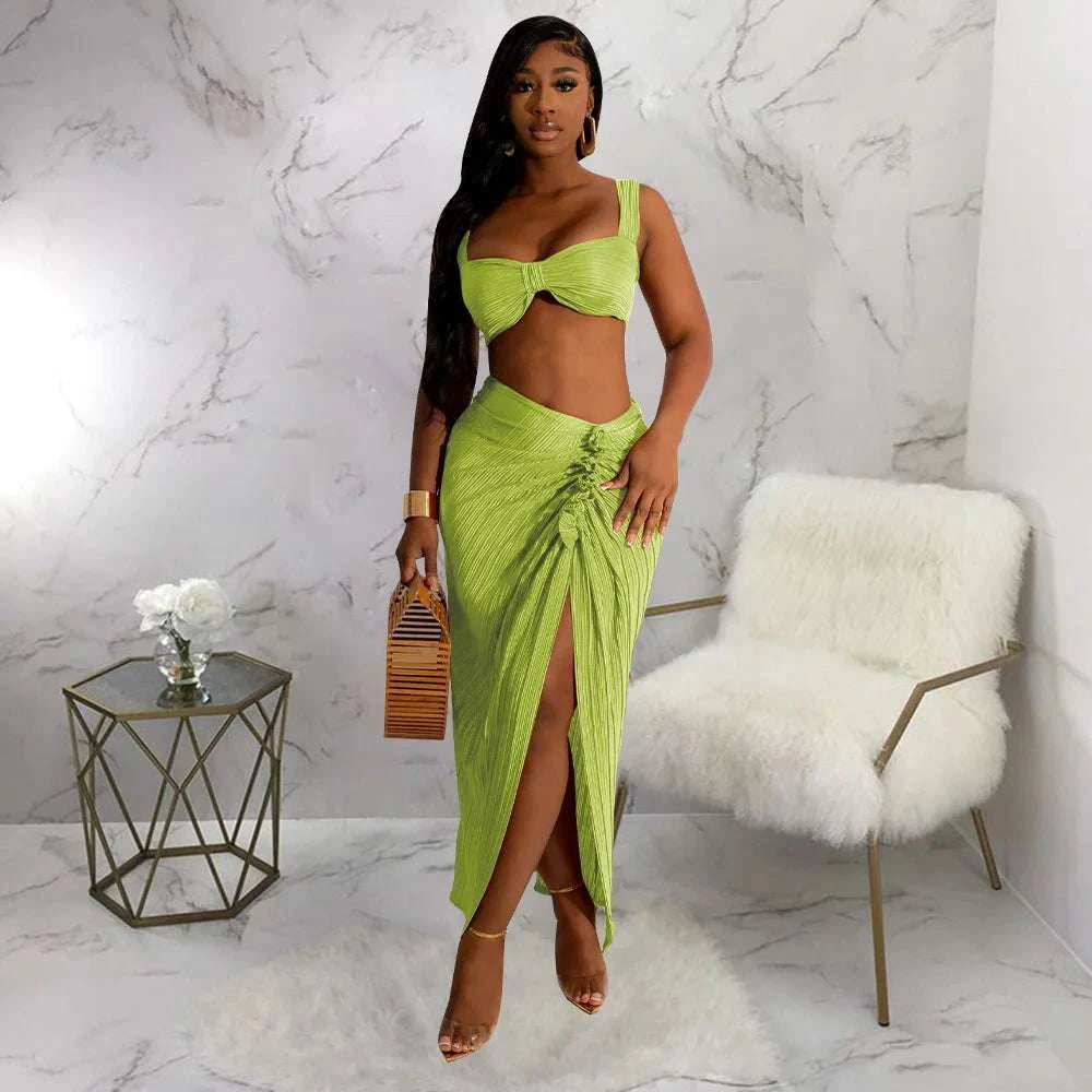 Women's summer two-piece set with backless halter top and high waist side slit pleated skirt.