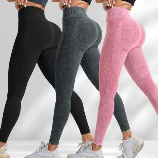 Three women wearing seamless high waist gym leggings in black, gray, and pink colors showcasing hip lifting and snug fit for outdoor sports and yoga.