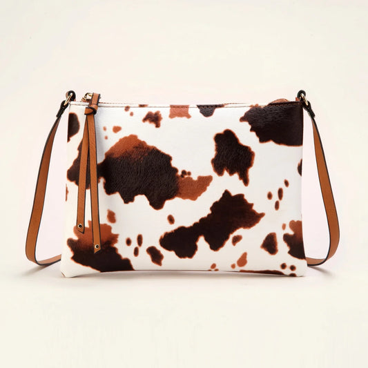 Small cow pattern PU leather crossbody bag for women with envelope shape and zipper closure