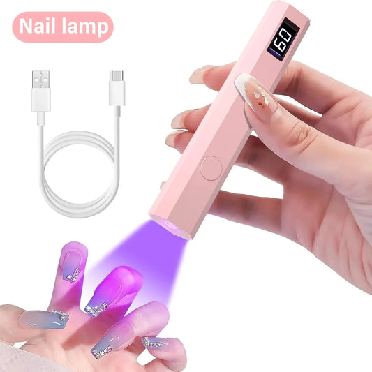 Handheld pink rechargeable nail dryer lamp with digital display and USB charging cable curing gel polish nails