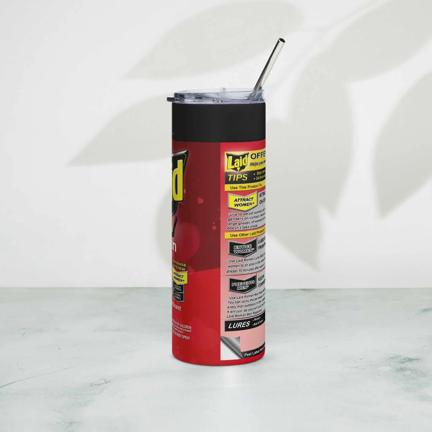 LAID Spray Can stainless steel tumbler with metal straw on a light background.