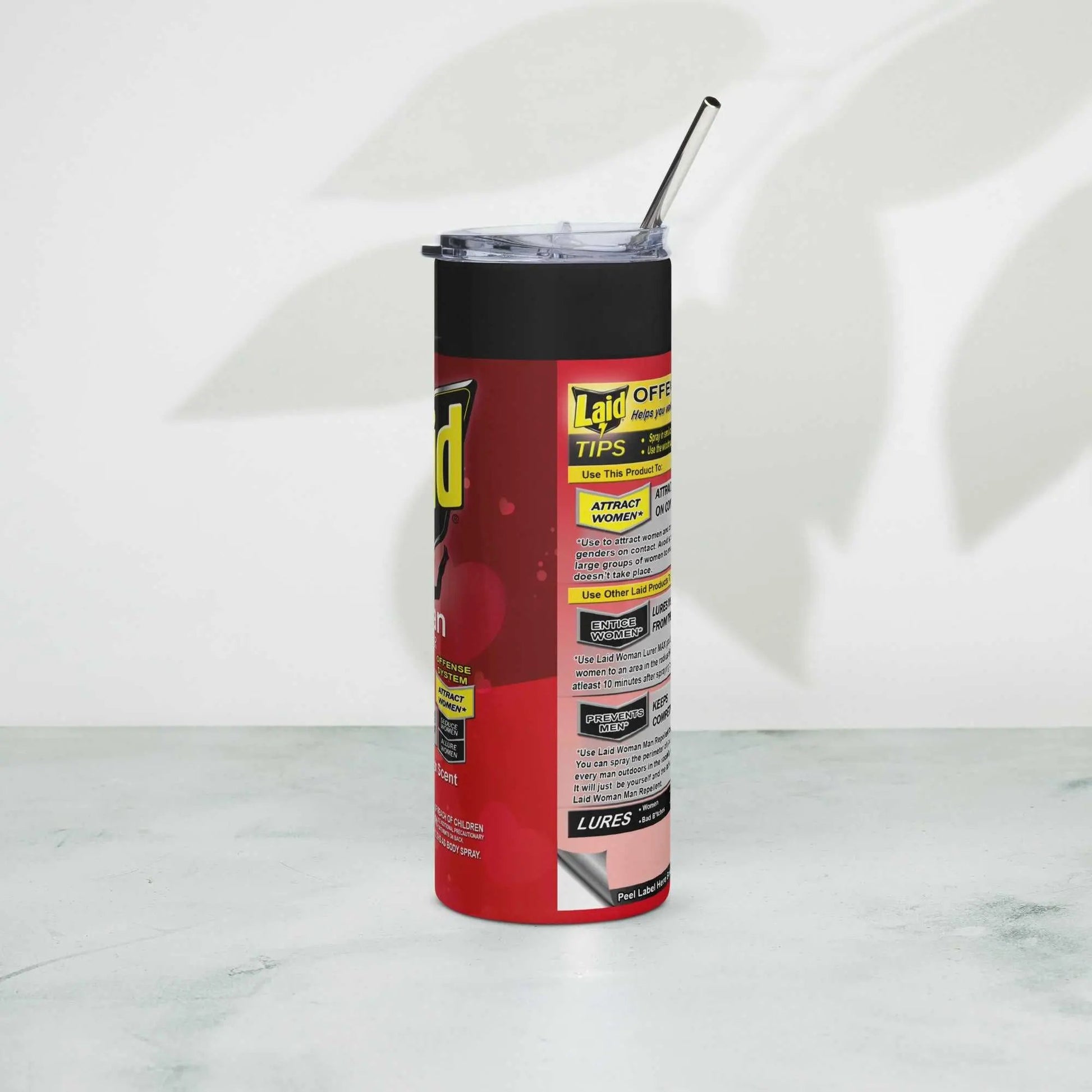 LAID Spray Can stainless steel tumbler with metal straw on a light background.