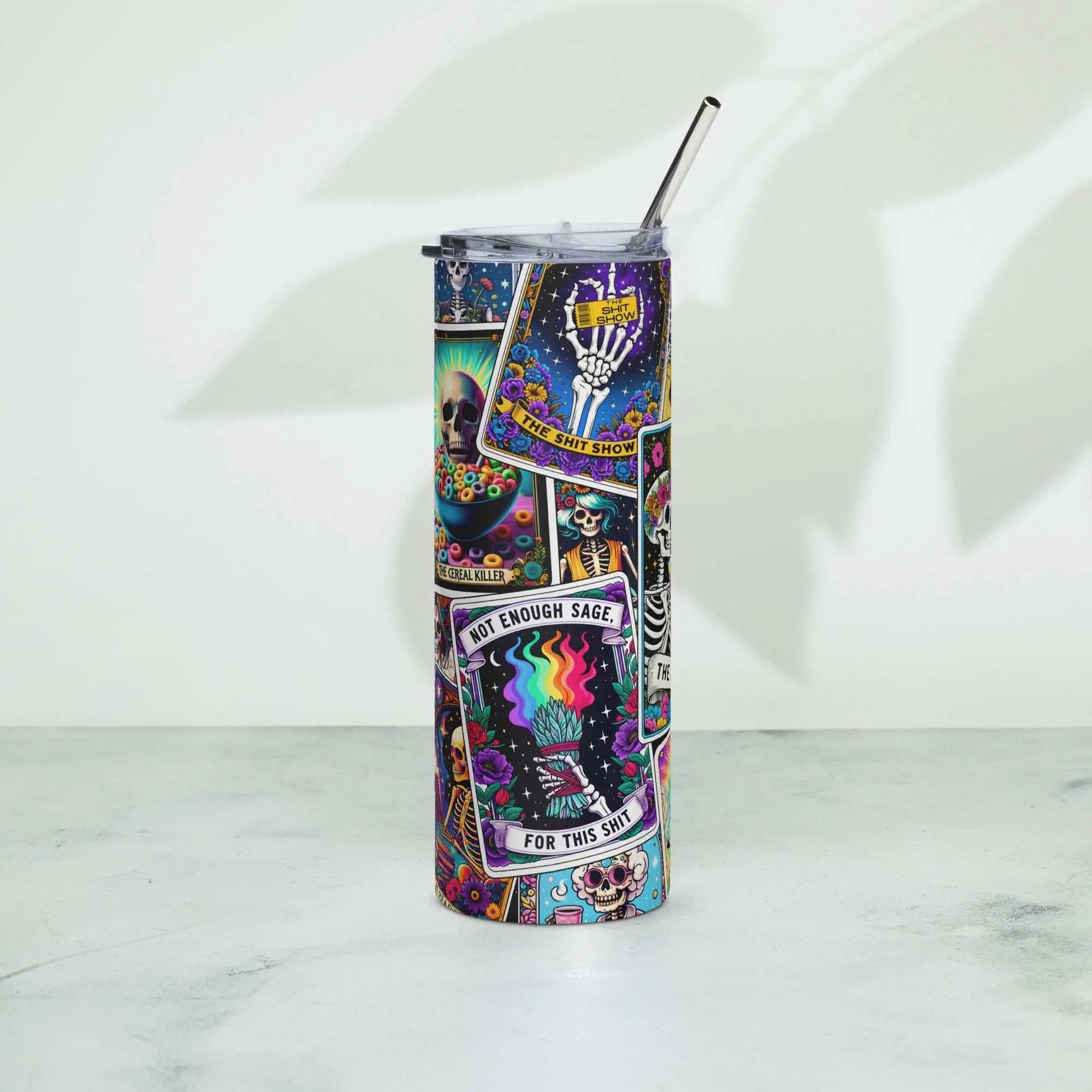 Colorful Tarot tumbler with stainless steel straw on white background.
