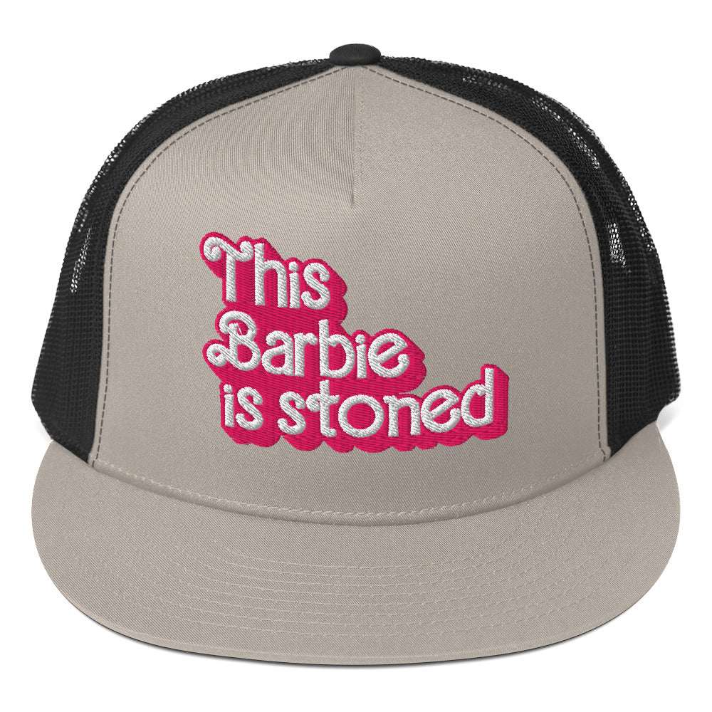 Barbie Trucker Cap with embroidered text, grey front panel, black mesh back, and flat bill.