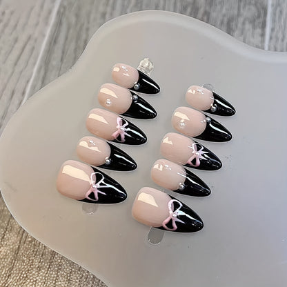 10 Pcs Hand-Painted Bow Tie Decorated French Manicure Press-On Nail Tips with Pearl Accents - Black and Pink Color Scheme, Almond Shape, Medium Length Good Vibrations