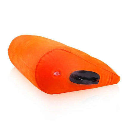 Inflatable orange wedge pillow for adult erotic games and positions.