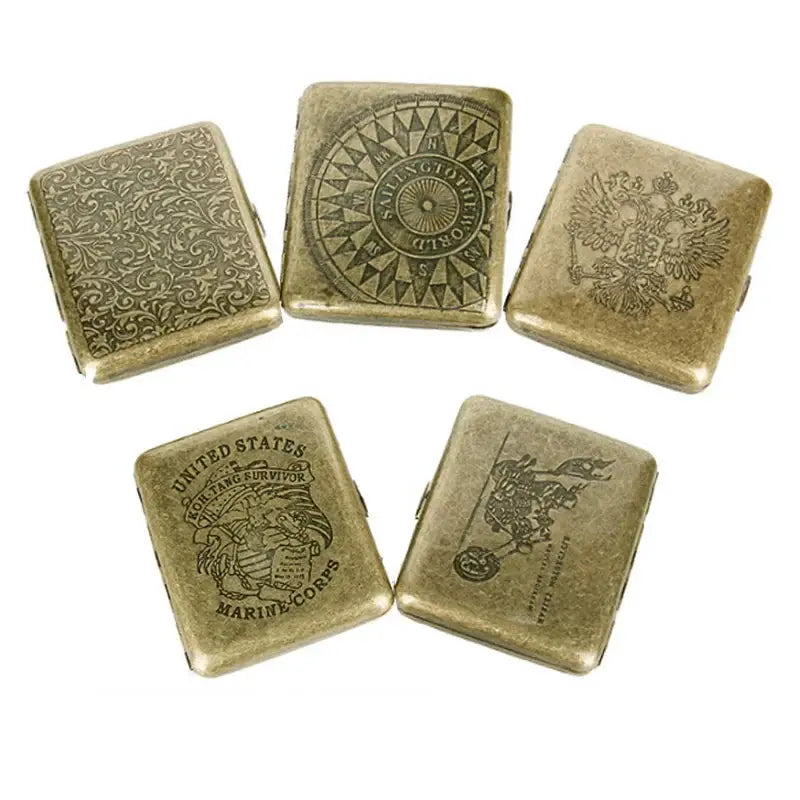 Vintage metal cigarette cases with classic engraved designs, suitable for holding 20 cigarettes.