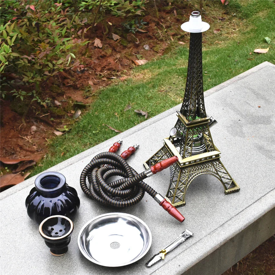 Paris Tower Metal Shisha Hookah set with double hose, ceramics bowl, charcoal tongs, shisha plate, and acrylic base, displayed outdoors.