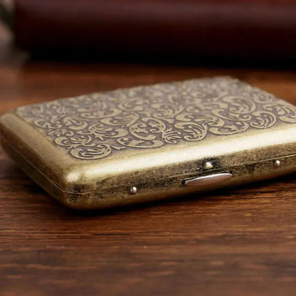 Vintage metal cigarette case with intricate classic design, holds 20 cigarettes, ideal gift for men.
