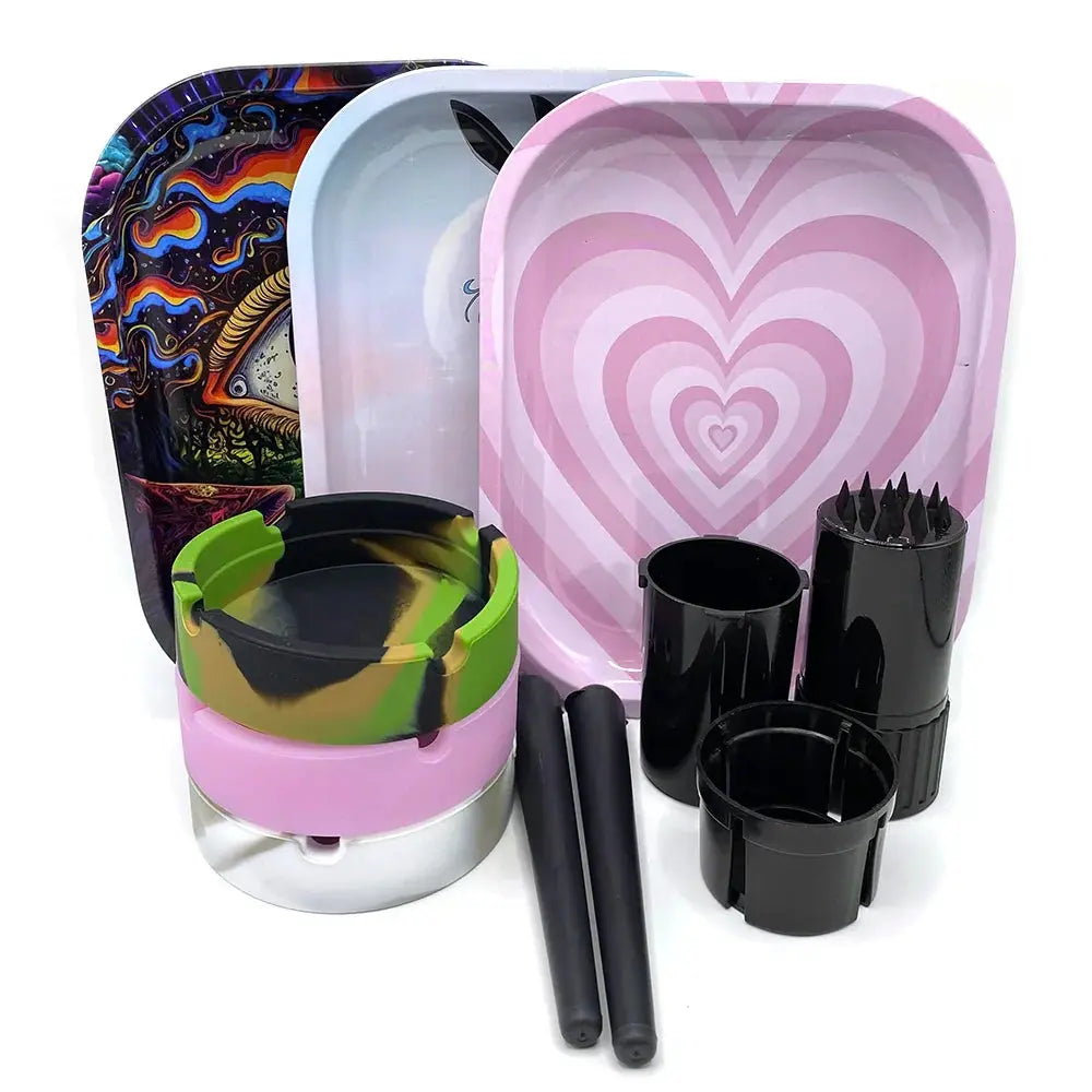 Cigarette plastic herb grinder set with metal rolling trays and silicone ashtray.