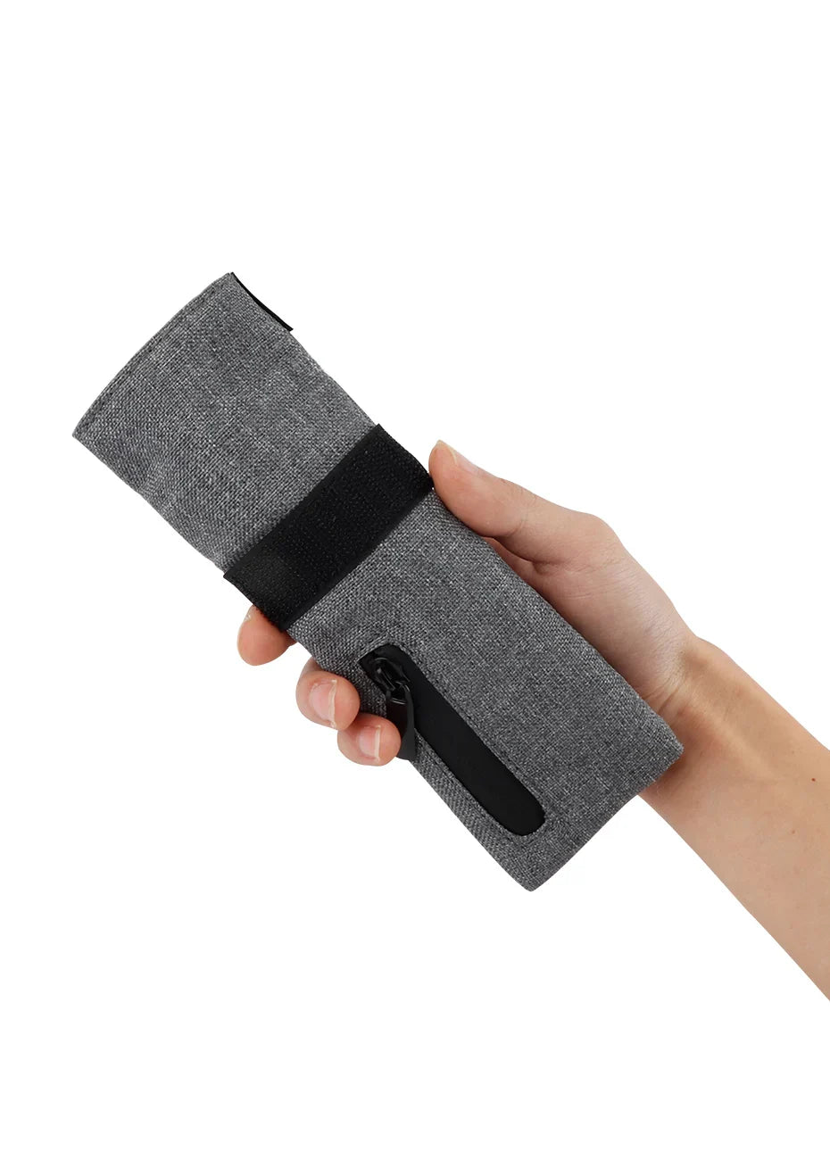 FIREDOG Smoking Smell Proof Pouch in hand, gray PU leather with zipper, compact design.