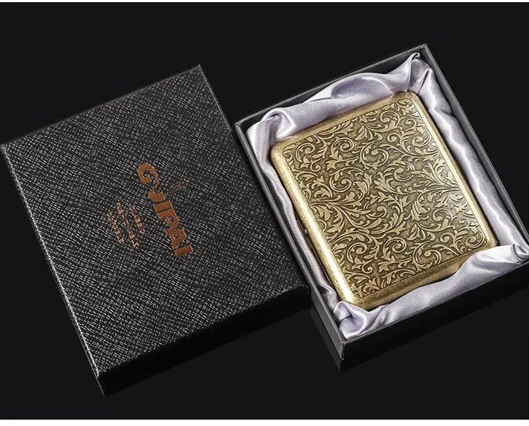Retro brass cigarette box with ornate design in gift box, tobacco storage case.