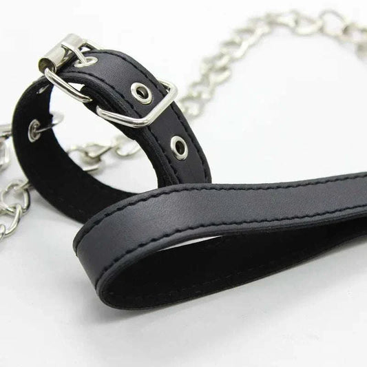 Black leather penis ring with metal chain for fetish bondage and BDSM training.