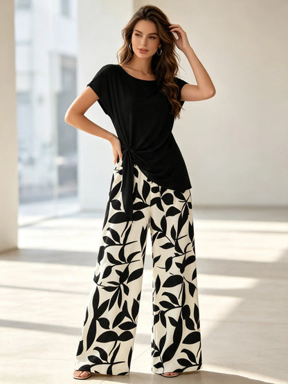 Women's plus Size Two-Piece Set Lazy Style Black Side Twisted T-Shirt And Black White Leaf Print Wide Leg Pants Casual Outfit Good Vibrations