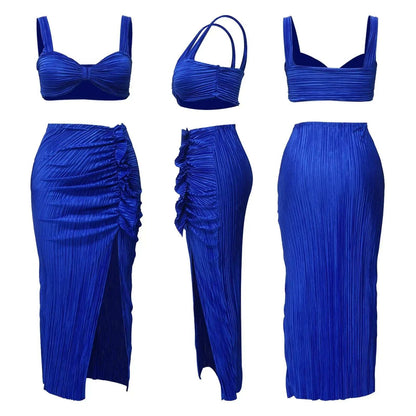 Blue two-piece summer set with backless halter top and high waist side slit pleated skirt suitable for beachwear.