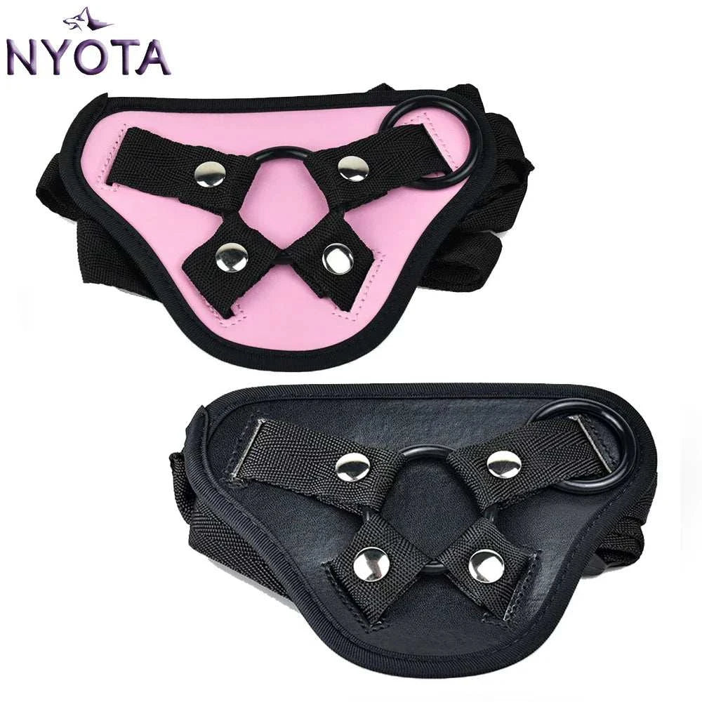 NYOTA adjustable leather strap-on harness in pink and black, suitable for bottom sex toys.