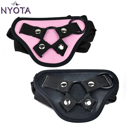 NYOTA adjustable leather strap-on harness in pink and black, suitable for bottom sex toys.