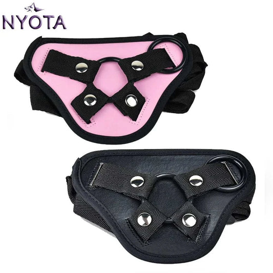 NYOTA adjustable leather strap-on harness in pink and black, suitable for bottom sex toys.