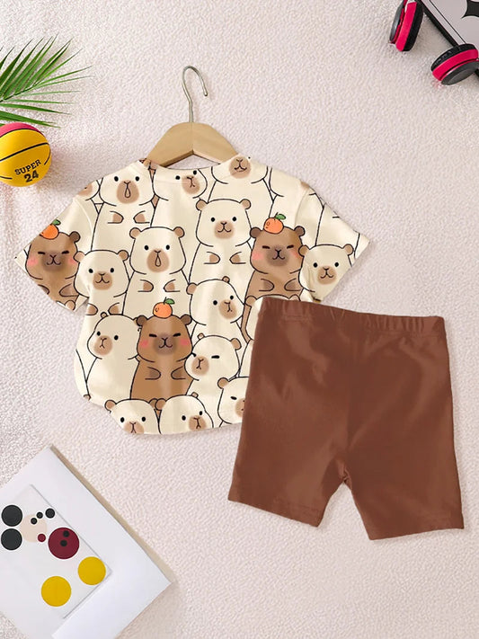 2Pcs Girls' Summer Shorts Set: Cute Cartoon "Capybara" Short-Sleeve Round Neck Top + Elastic Waist Solid Color Printed Slim Shorts. Girls' Casual Outdoor Wear, Versatile, Skin-Friendly, Soft Children's Clothing. Fashionable, Good Vibrations