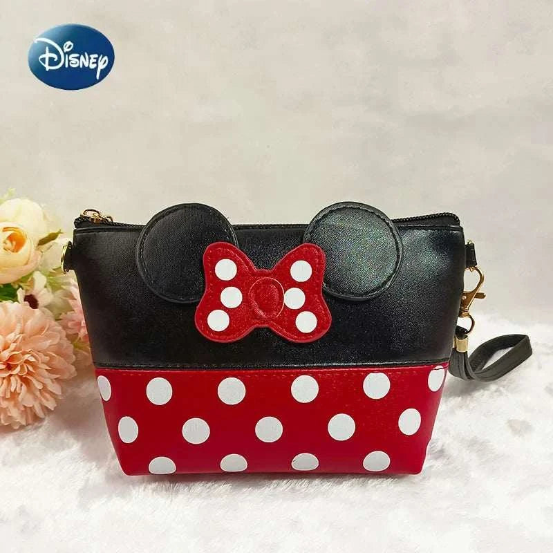Disney Minnie Mouse black and red polka dot coin purse with bow and ears design, leather travel cosmetic bag