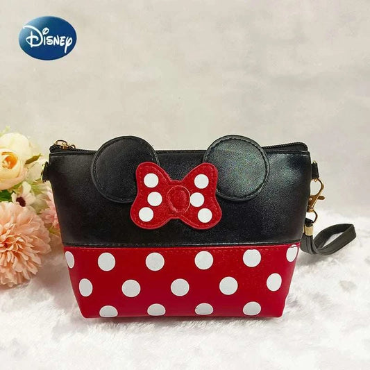 Disney Minnie Mouse black and red polka dot coin purse with bow and ears design, leather travel cosmetic bag