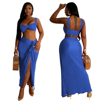 Two-piece summer dress set with backless halter top and high waist side slit pleated skirt in blue.