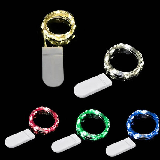 Waterproof LED copper wire fairy lights in white, red, green, and blue colors with battery-operated white controllers for party and wedding decoration.