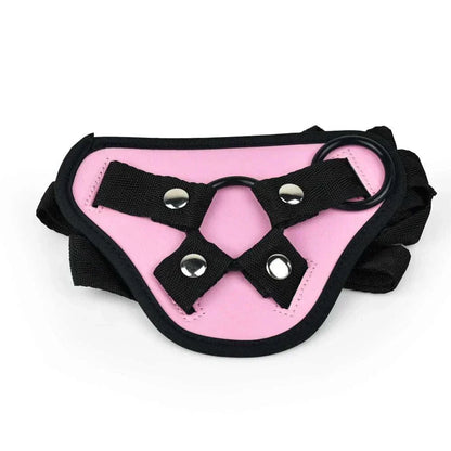Adjustable pink strap-on harness with black straps for bondage use.
