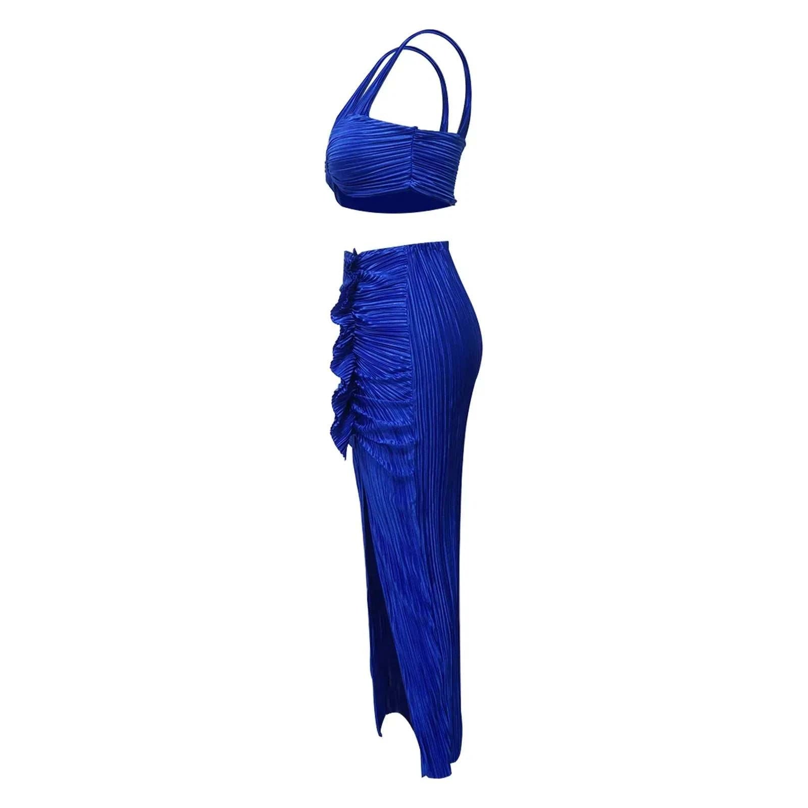 Summer two-piece set with sexy backless halter top and high waist side slit pleated skirt in vibrant blue.