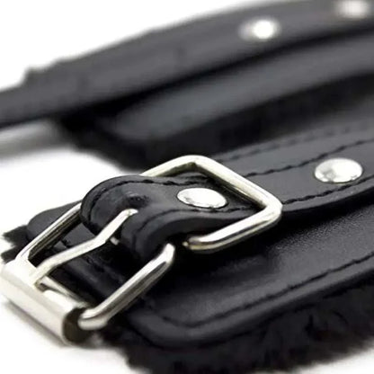 Soft plush BDSM bondage handcuffs with adjustable straps and metal buckles.