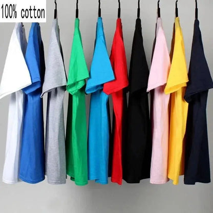 Assorted colored 100% cotton tees hanging on a rail.