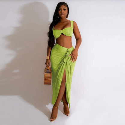 Backless halter top and high waist side slit pleated skirt set for women.