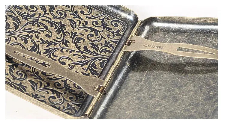 Retro brass cigarette box with intricate frosted design and secure closure mechanism.