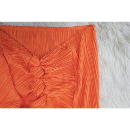 Orange high waist side slit pleated skirt detail, ideal for matching lady streetwear.