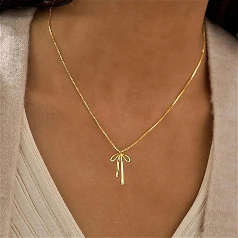 Simple Elegant Cross Bow Necklace for Women Attractive Motifs Golden Alloy Layered Necklace Party Jewellery Accessories Good Vibrations