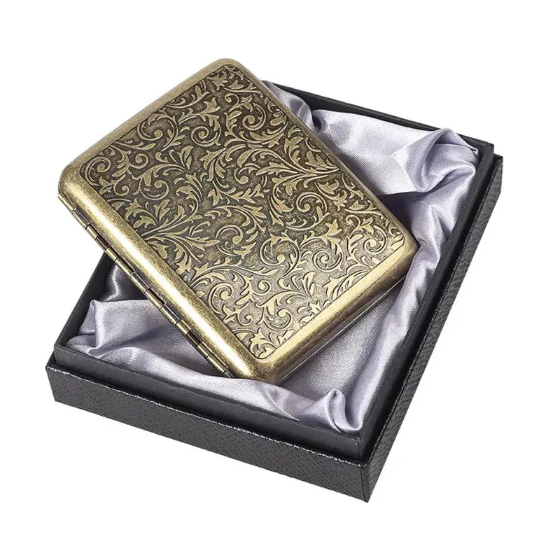 Retro brass cigarette box holder with intricate floral design in a gift box