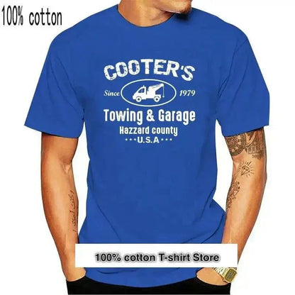 Blue cotton T-shirt with "Cooter's Towing & Garage Hazzard County USA" print.