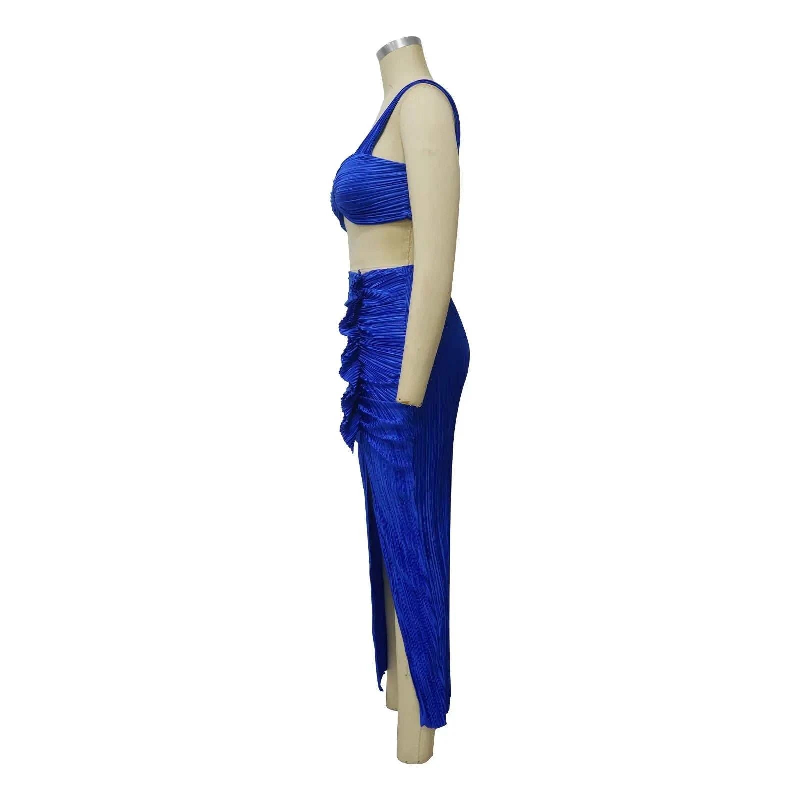 Summer two-piece set with a backless halter top and high waist side slit pleated skirt, perfect for beach streetwear.