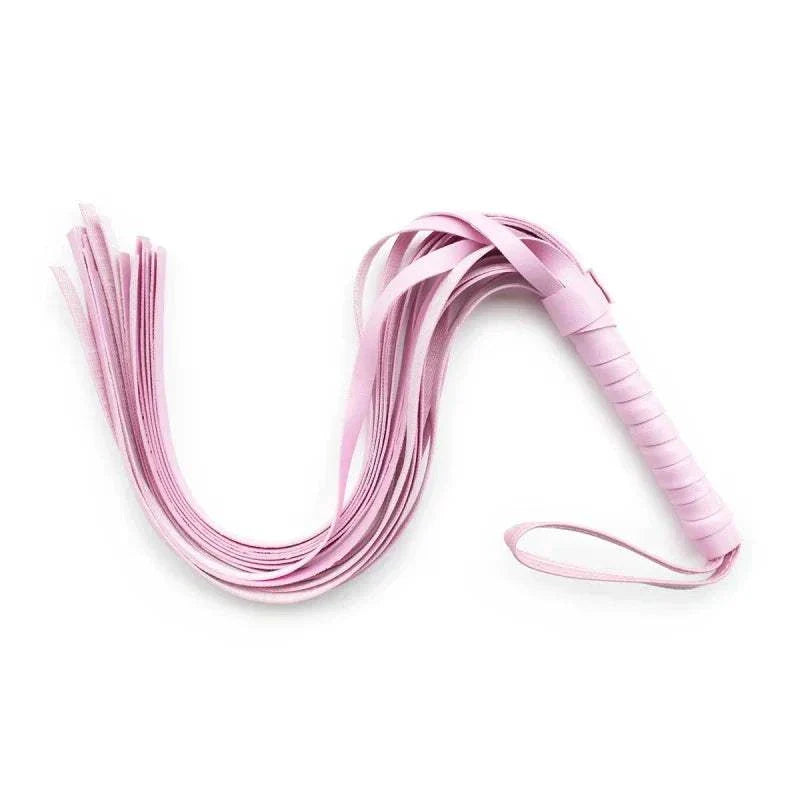 Pink leather BDSM whip for erotic accessories and bondage games.