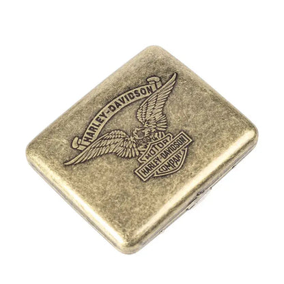 Retro brass cigarette box with an engraved design, used for storing cigarettes and cigars.