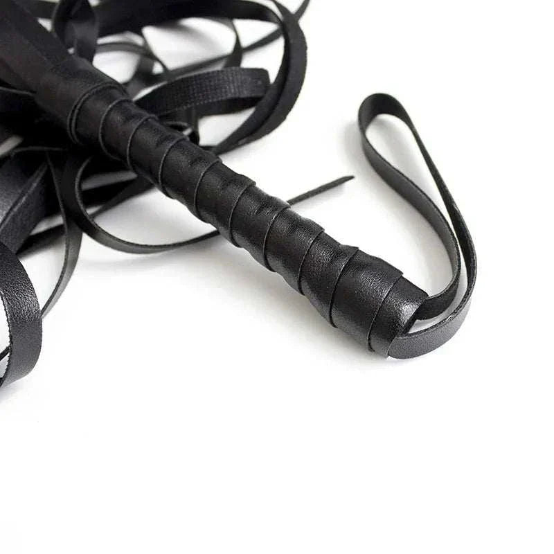 BDSM leather flogger whip with a wrapped handle for adult games and erotic play.