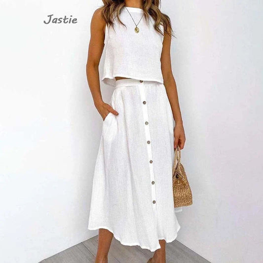 White sleeveless cotton linen summer outfit for women with a loose vest and buttoned mid-calf skirt