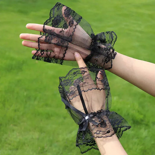 Gothic black lace fingerless gloves with vintage design, featuring hollow lace and wrist cuffs, ideal for women seeking classic, sexy short arm sleeves.