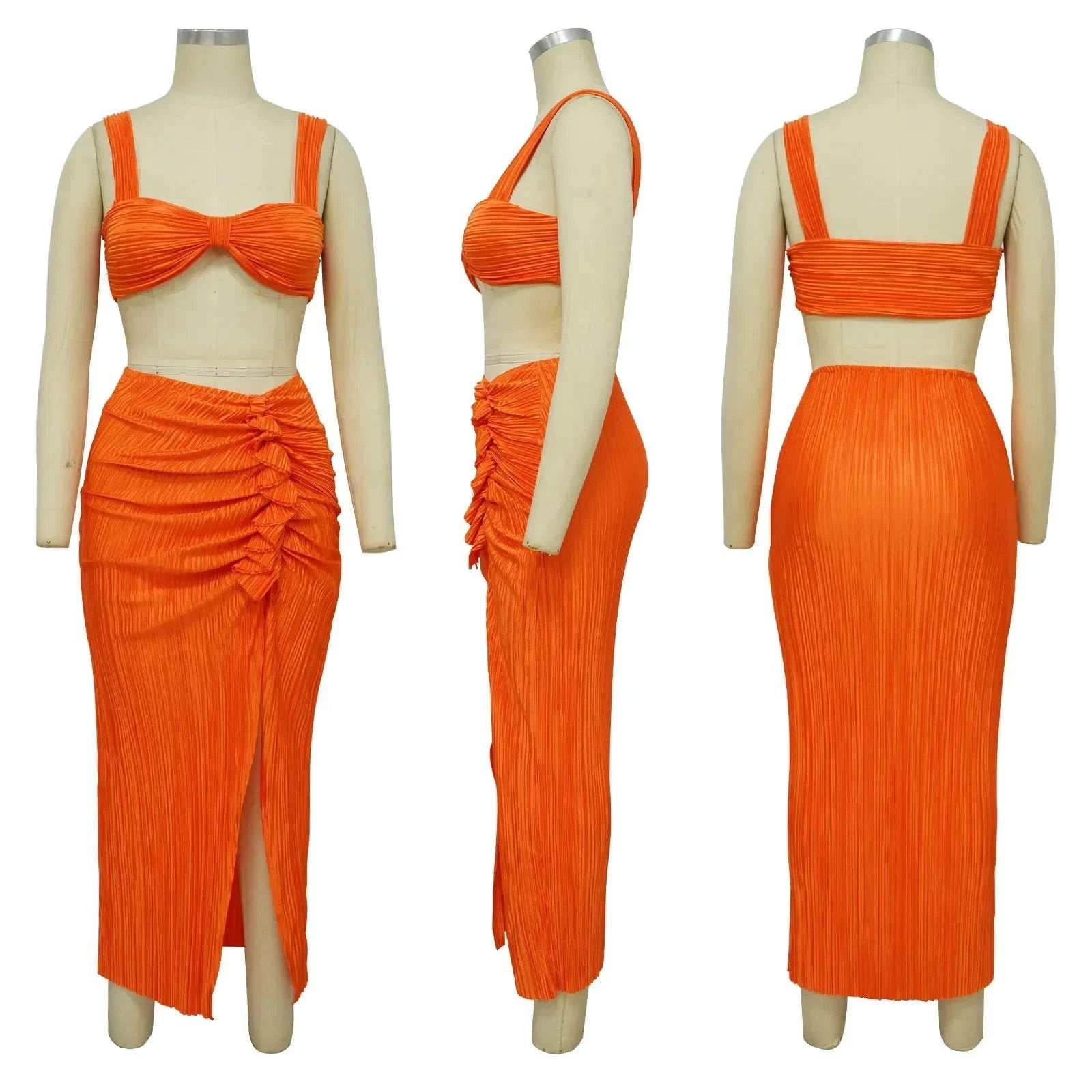 Summer two-piece set with a backless halter top and high waist side slit pleated skirt in orange, perfect for spring and summer lady streetwear.
