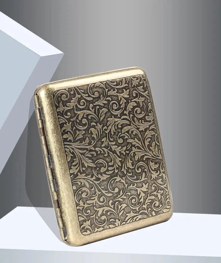 Retro brass cigarette box with decorative frosted finish for tobacco storage.